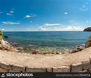 Beautiful panoramic photo of turquoise sea and cliffs at sunny day