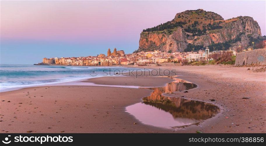 Beautiful panoramic view of the beach, Cefalu Cathedral and old town of coastal city Cefalu at pink sunset, Sicily, Italy. Cefalu at sunset, Sicily, Italy