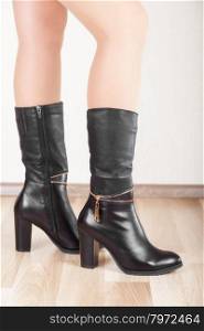 Beautiful patent leather boots with slender legs