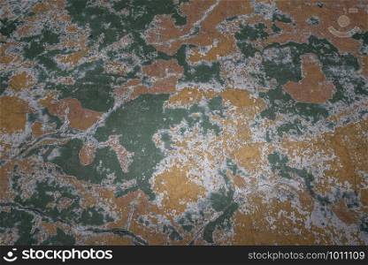 Beautiful patterns on the Old plastered field with falling off flakes of paint. Texture, background, different color patterns, copy space.