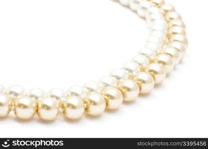 Beautiful pearl necklace closeup on white background