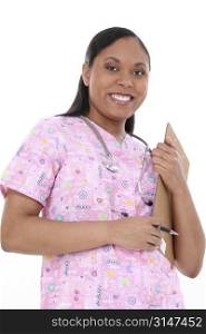 Beautiful pediactric nurse in pink scrubs writing on clipboard. Look of concentration on face.