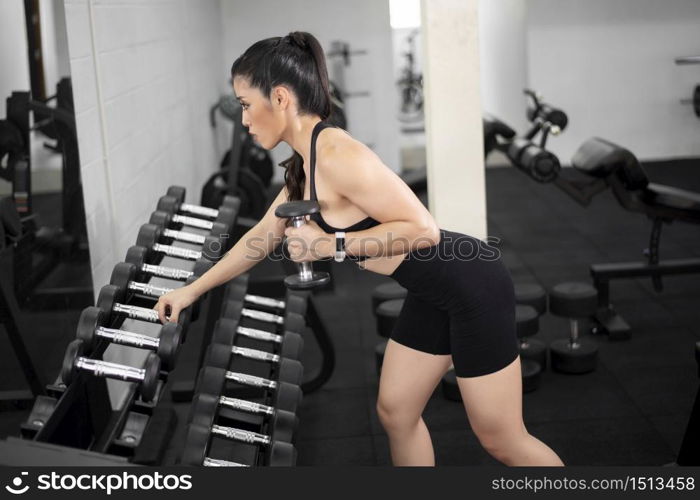 Beautiful perfect body woman is work out in the gym