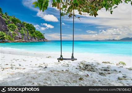 Beautiful Petite Anse beach with swing at Mahe, Seychelles