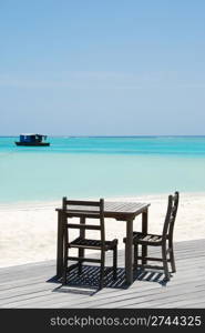 beautiful photo of a tropical view at a beach bar in a maldivian island