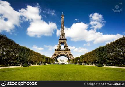 Beautiful photo of the Eiffel tower in Paris with gorgeous colors and wide angle central perspective.