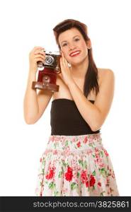Beautiful photographer. Cute lovely retro style summer teen girl holding using vintage old camera isolated on white background