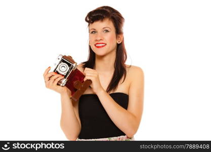 Beautiful photographer. Cute lovely retro style summer teen girl holding using vintage old camera isolated on white background