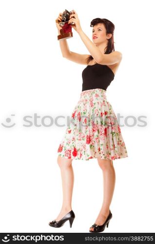 Beautiful photographer. Cute lovely retro style summer teen girl taking self-portrait from vintage film camera isolated on white background
