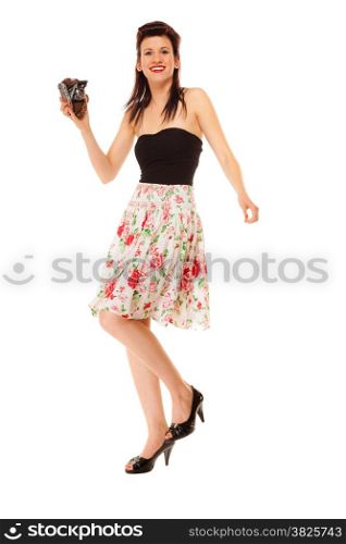 Beautiful photographer. Full length pretty retro style summer teen girl holding using vintage old camera isolated on white background