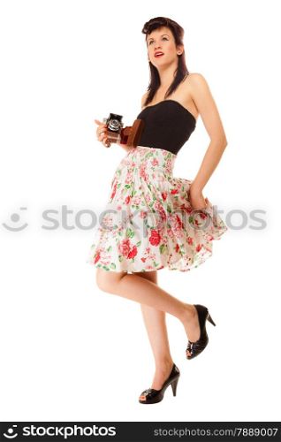 Beautiful photographer. Full length pretty retro style summer teen girl holding using vintage old camera isolated on white background