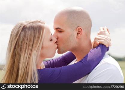 Beautiful picture of kissing couple at outdoor