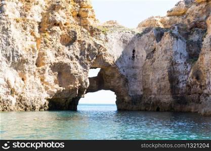 Beautiful picturesque rocky cliffs in the ocean, Portugal. Beautiful cliffs in the ocean