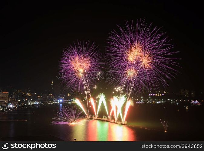 Beautiful pink firework at Pattaya coast with cityscape background, Thailand
