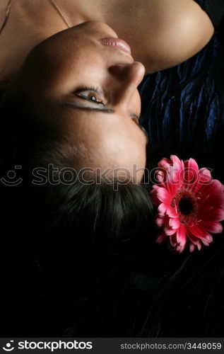 beautiful pink flowers in girl hair