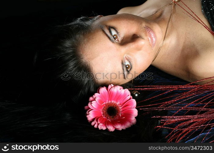 beautiful pink flowers in girl hair