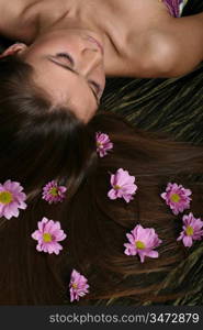 beautiful pink flowers in girl hair