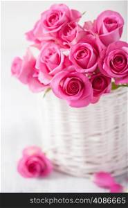 beautiful pink roses bouquet in basket