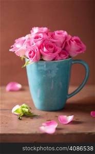 beautiful pink roses bouquet in mug