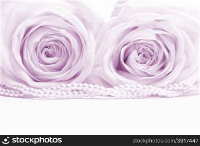 Beautiful pink roses with pearls toned in sepia can use as wedding background. Soft focus.