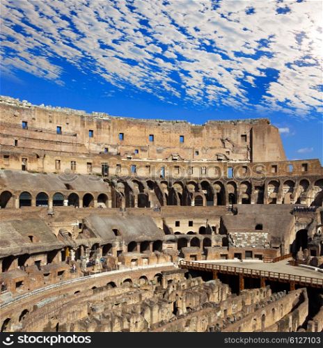 Beautiful plumose clouds over the ancient Colosseum. Rome. Italy