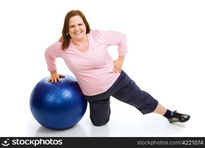 Beautiful plus sized model working out with a pilates fitness ball. Full body isolated on white.