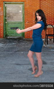 Beautiful police detective woman on the job with a gun