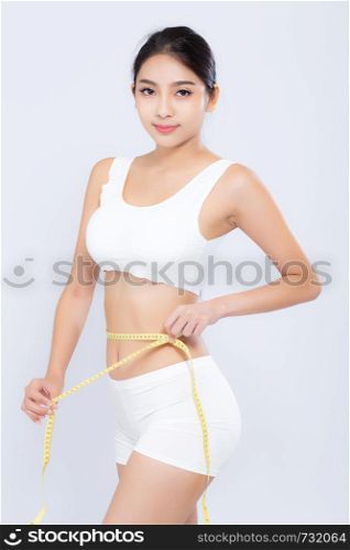 beautiful portrait asian woman diet and slim with measuring waist for weight isolated on white background, girl have cellulite and calories loss with tape measure, health and wellness concept.