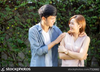 Beautiful portrait couple looking each others eyes and smiling with happy, young asian man and woman relation with love dating, husband and wife feeling and emotion, lovers and lifestyle concept.