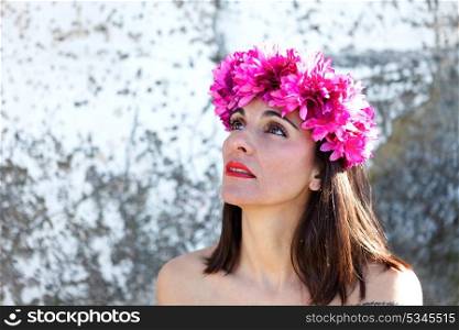 Beautiful portrait of a mature woman with black hair, red lips and fashion headband
