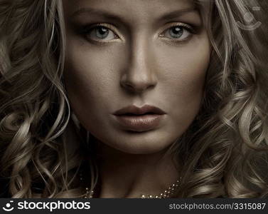 Beautiful portrait of a young woman, dark light