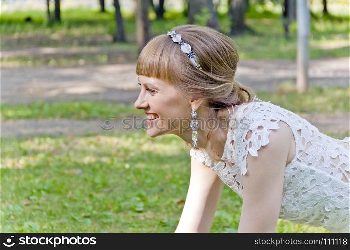 Beautiful portrait of bride with diadem in summer background