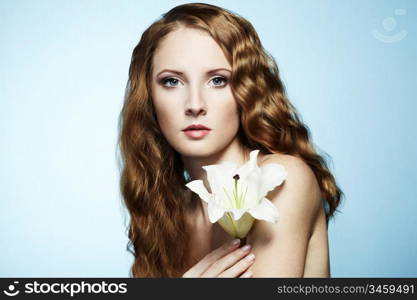 Beautiful portrait of young sensual woman with flower