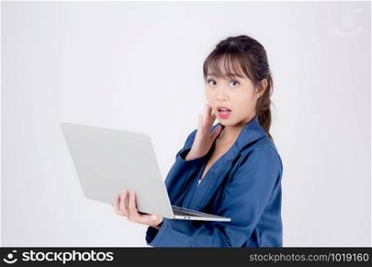 Beautiful portrait young asian business woman holding laptop computer isolated on white background, businesswoman looking notebook with surprise and amazing, asia freelance girl work job and wonderful.