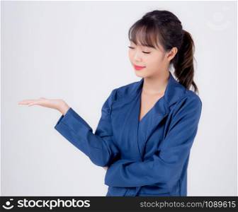 Beautiful portrait young asian business woman presenting and showing with confident isolated on white background, asia secretary or adviser businesswoman hand palm with empty for advertising concept.