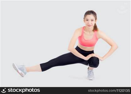 Beautiful portrait young asian woman fitness with stretching leg isolated on white background, asia girl workout with full body exercise and warm up, body care and healthy concept.
