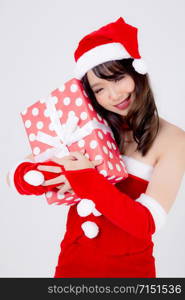 Beautiful portrait young asian woman happy holding red gift box with excited in xmas holiday isolated on white background, asia girl surprise and celebrating in festive Christmas and new year.