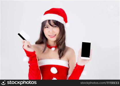 Beautiful portrait young asian woman in Santa shopping for credit card with smart mobile phone in Christmas holiday isolated on white background, beauty asia girl buying gift in xmas day or new year.
