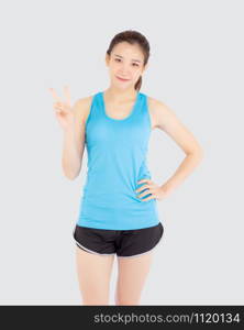 Beautiful portrait young asian woman in sport clothes with satisfied and confident gesture finger v sign isolated on white background, asia girl have shape and wellness, exercise for fit with health.