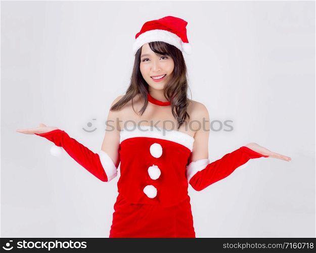 Beautiful portrait young asian woman Santa costume presenting empty plam with happy in holiday xmas, beauty model asia girl cheerful and surprise celebrating in Christmas isolated on white background.