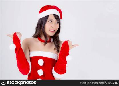Beautiful portrait young asian woman Santa costume wear hat smiling with happy in holiday xmas, beauty model asia girl cheerful and happiness celebrating in Christmas isolated on white background.