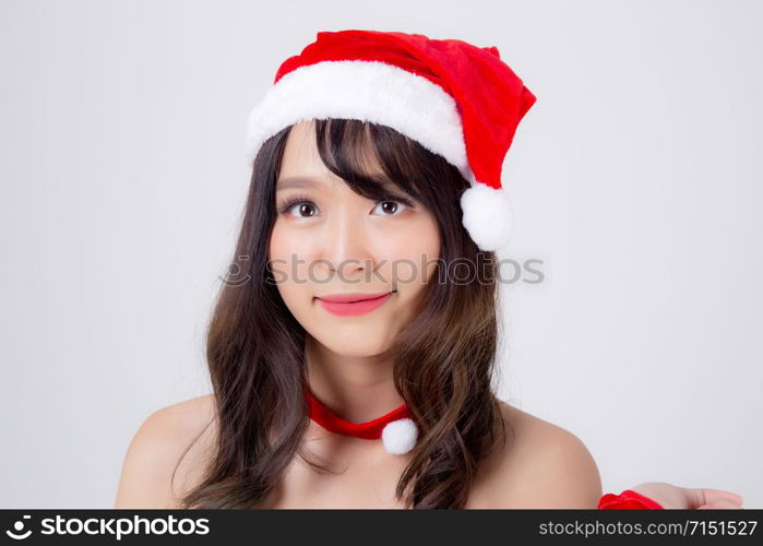 Beautiful portrait young asian woman Santa costume wear hat smiling with happy in holiday xmas, beauty model asia girl cheerful and happiness celebrating in Christmas isolated on white background.