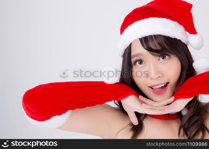 Beautiful portrait young asian woman Santa costume wear hat surprise and excited in holiday xmas, beauty model asia girl cheerful and happiness celebrating in Christmas isolated on white background.