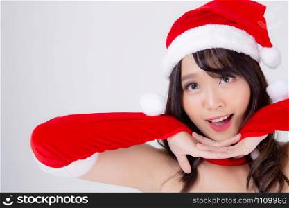 Beautiful portrait young asian woman Santa costume wear hat surprise and excited in holiday xmas, beauty model asia girl cheerful and happiness celebrating in Christmas isolated on white background.