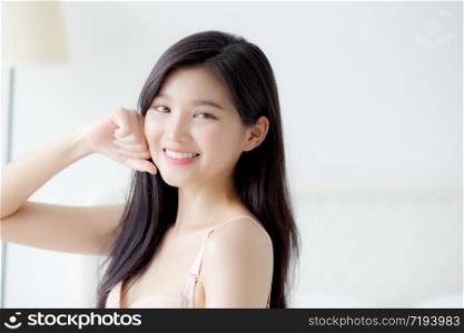 Beautiful portrait young asian woman sexy in underwear figure fit relax with seductive in bedroom, beauty asia girl body slim in lingerie confident and happy stand in bedchamber, lifestyle concept.