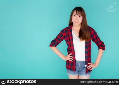 Beautiful portrait young asian woman wear clothes fashion travel thinking idea and enjoy summer holiday isolated blue background, girl smiling confident and cheerful, travel in vacation concept.