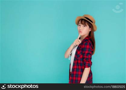 Beautiful portrait young asian woman wear hat having sunglasses confident and enjoy summer holiday isolated blue background, tourist model happy asia girl thinking idea planning travel concept.