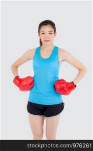 Beautiful portrait young asian woman wearing red boxing gloves with strength and strength isolated on white background, girl workout exercise is sport training with punch, health concept.