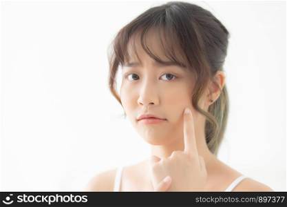 Beautiful portrait young asian woman with acne problem in the bedroom, trouble of beauty on face, zit treatment, asia girl is pimple having worry and displeased, skincare and healthy concept.
