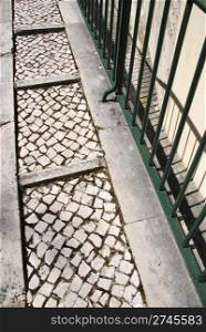 beautiful portuguese sidewalk view made of calcada stones pavement